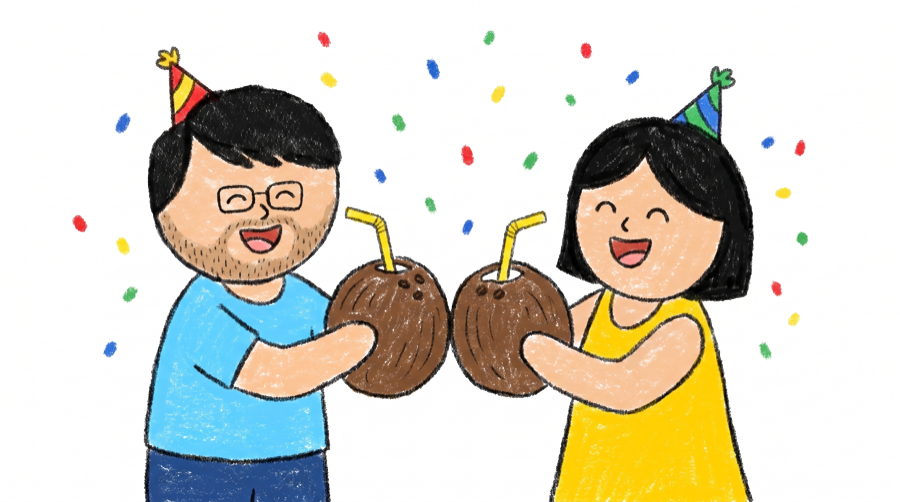 Sahil and Nikita toasting coconuts in party hats